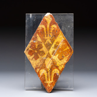 A medieval lozenge-shaped 'Fleur-de-Lys' tile, Chateau de Beauté, France, 14th C.