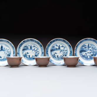 Four Chinese blue and white capucin-ground cups and saucers with landscape design, Yongzheng