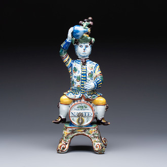 A rare polychrome Dutch Delft figural wine cistern and cover, 18th C.