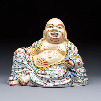 A polychrome Dutch Delft 'Budai' figure, 19th C.
