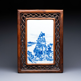 A Chinese blue and white 'mountainous landscape' plaque mounted in a wooden frame, 19/20th C.