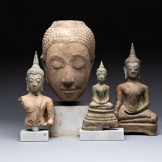 Three Southeast Asian bronze Buddhas and a stone head of Buddha, 18th C.