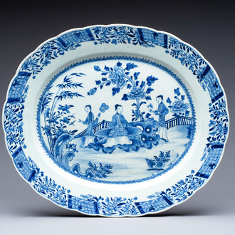 A Chinese blue and white 'ladies in a garden' serving dish, Qianlong