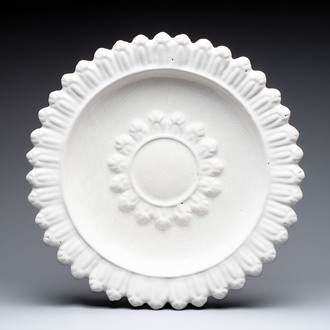 A large white-glazed Delftware 'sunburst' dish, France, 17th C.