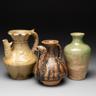 Two Chinese brown-glazed ewers and a celadon-glazed vase, one ewer dated 1571 with a Longqing mark, Qing and later