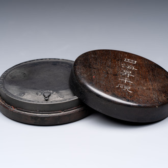 A Chinese carved circular Duan inkstone in a zitan box, signed Dong Jiaozeng 董教增, 18/19th C.