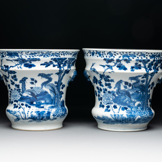 A pair of Chinese blue and white 'birds among flowering branches' jardinières, 19th C.