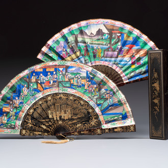 Two Chinese Canton gilt-lacquered and painted paper fans, one with its original box, 19th C.