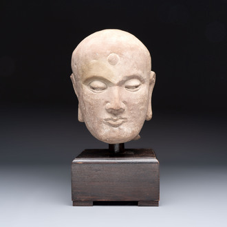 A Chinese sandstone head of a Luohan, early Qing