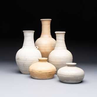 Three cream-glazed bottle vases and two jarlets from the Jepara shipwreck, Dehua or Anxi kilns, Song