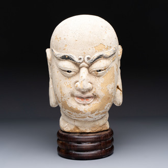 A Chinese stucco head of a Luohan, Qing