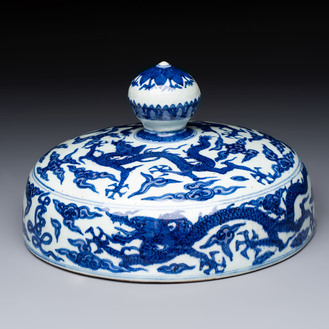 A Chinese blue and white 'dragon among clouds' cover, 20th C.