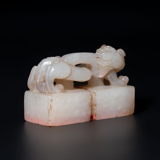 A Chinese celadon and russet jade 'chilong' seal, 18/19th C.
