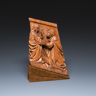 A carved oak retable fragment depicting 'The Visitation', North-Brabant, 15th C.