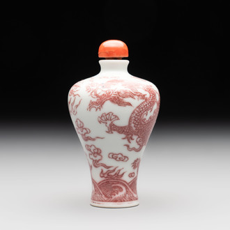 A Chinese blue, white and copper-red 'dragon' snuff bottle, 19th C.