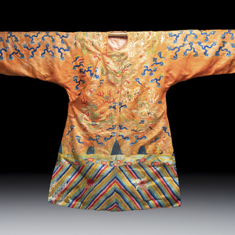 A Chinese embroidered silk salmon-ground 'dragon' robe, 19th C.