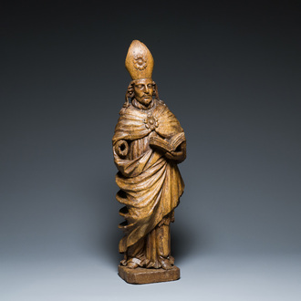A large carved oak sculpture of a bishop, Flanders, 16th C.