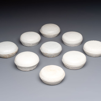 Nine Chinese white-glazed boxes and covers with incised floral design from the Jepara shipwreck, Dehua or Anxi kiln, Song