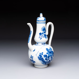 A Chinese blue and white ewer and cover with floral design, Kangxi