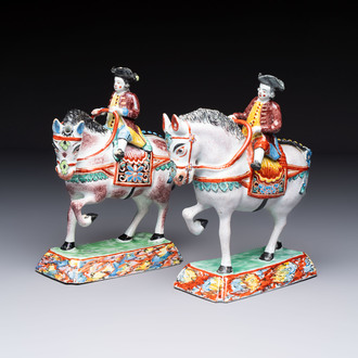 A pair of polychrome Dutch Delft petit feu models of horses with riders, 18th C.