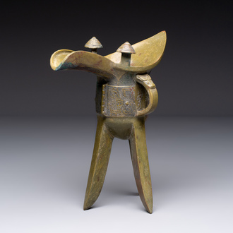 A Chinese archaic bronze wine vessel, 'jue 爵', late Shang