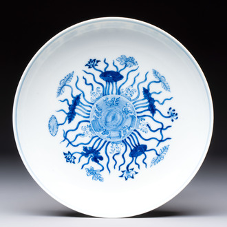A Chinese blue and white 'lotus pond' plate, Qianlong mark, 19/20th C.