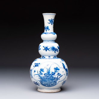 A Chinese blue and white double gourd 'Antiquities' vase, Kangxi