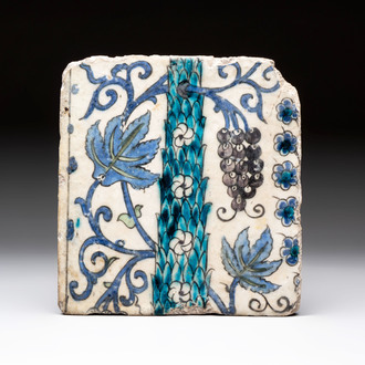 A polychrome Damascus tile with grapevines and flowers, 17th C.