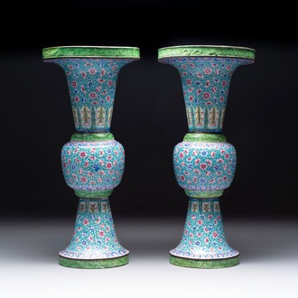 A pair of Chinese Canton enamel 'gu' vases with floral design, Qianlong