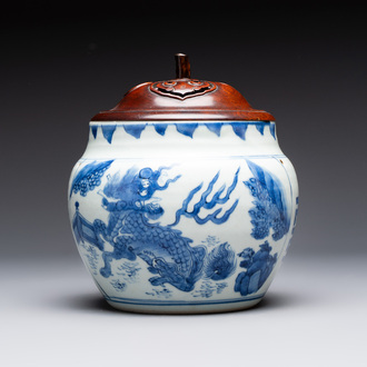 A Chinese blue and white 'qilin' jar and wooden cover, Transitional period