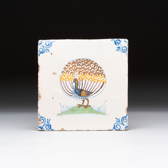 A polychrome Dutch Delft 'peacock' tile, 17th C.