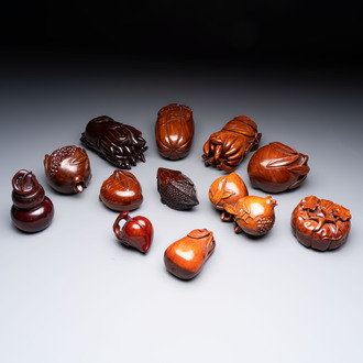 12 various Chinese carved huali and hongmu fruit-form covered boxes, 20th C.