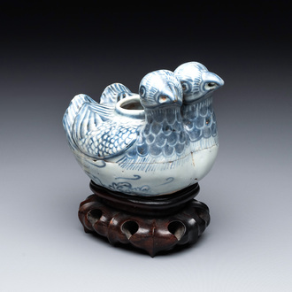 A Chinese blue and white 'double mandarin duck' ewer or water dropper on wooden stand, Ming, ca. 1500