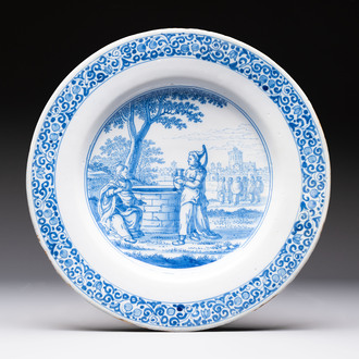 A large blue and white Dutch Delft dish with Jesus and the Samaritan woman, ca. 1680