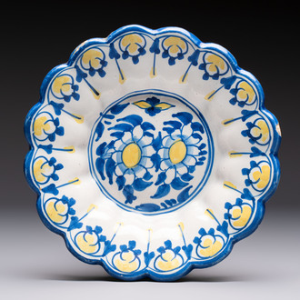 A small polychrome lobed Dutch Delft dish with floral design, 17th C.