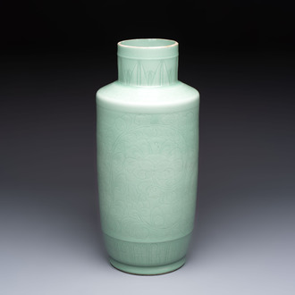 A Chinese celadon-glazed rouleau vase with incised floral design, 18th C.