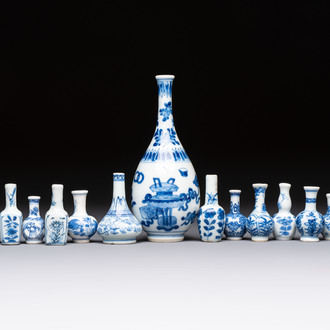 A group of 12 Chinese blue and white miniature vases and a small bottle vase, Kangxi