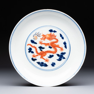 A Chinese blue and white iron-red-decorated 'Dragon' plate, Jing Jin Tang 精進堂 mark, 19th C.