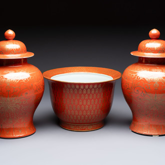 A pair of Chinese gilt-decorated coral-ground covered vases and a 'Double Happiness 囍' jardinière, 19th C.