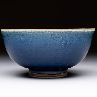 A Chinese blue-glazed 'Hatcher Cargo' bowl with incised dragons, Transitional period