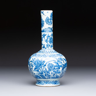 A Chinese blue and white bottle vase with floral design, hare mark, Wanli
