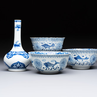 Three Chinese blue and white 'Fish' bowls and a bottle vase, Kangxi marks, 19th C.
