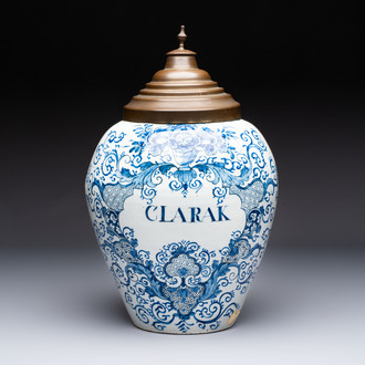 A large blue and white Dutch Delft tobacco jar, inscribed 'Clarak', 18th C.