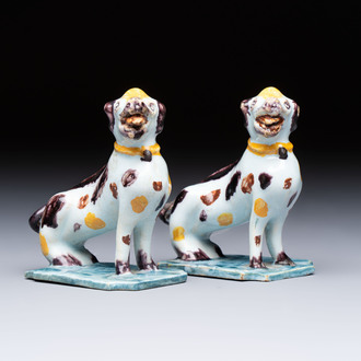 A pair of polychrome Dutch Delft models of dogs, 18th C.