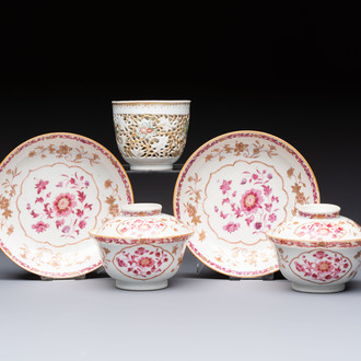A pair of Chinese famille rose gilt-decorated covered cups and saucers and an openworked cup, Qianlong