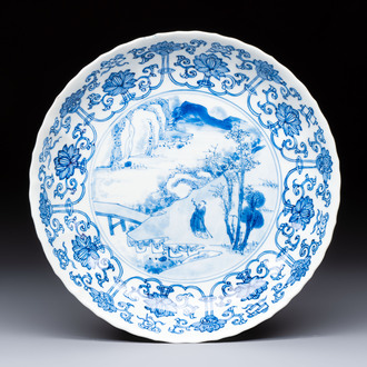 A very fine Chinese blue and white plate with a scholar in a landscape, Kangxi mark and of the period