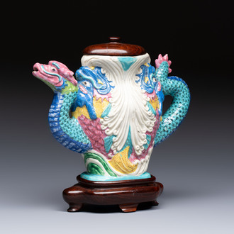 A Chinese famille rose ewer in the form of a dragon and two carps with wooden cover and stand, 19th C.