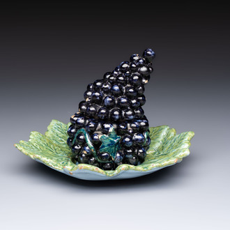 A polychrome Dutch Delft 'Bunch of Grapes' tureen and cover, 18th C.