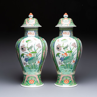 A pair of famille verte-style 'Lotus Pond and Flower Basket' vases and covers, Samson, Paris, 19th C.