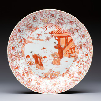 A Chinese iron-red and gilt-decorated dish with a garden scene, Kangxi
